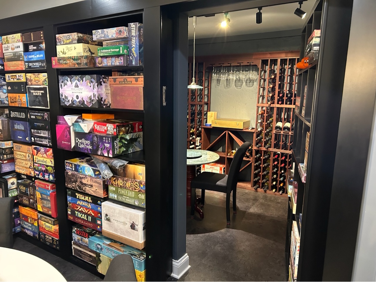 Hidden door open to reveal concealed room behind a built-in design